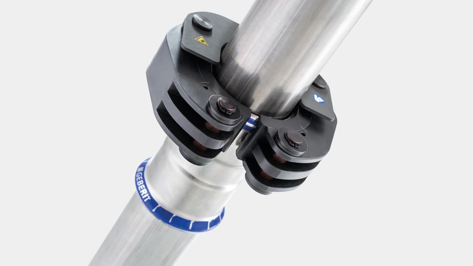 Snäpplåsmekanismen fixerar Geberit presslinga på Geberit Mapress rördel Snäpplåsmekanismen fixerar Geberit presslinga på Geberit Mapress rördel